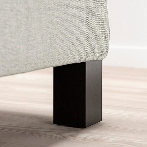 Una pata de cama moderna, negra, con soporte y estilosa.