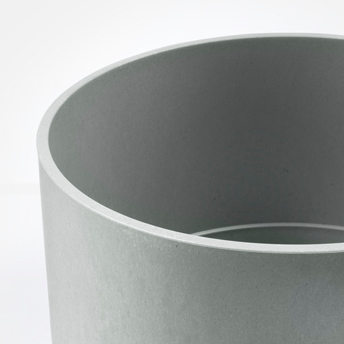 Jardinera cilíndrica moderna, gris mate, textura lisa, diseño minimalista.