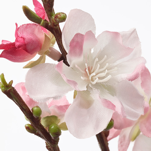 Flores artificiales realistas en tonos rosas y blancos. Delicados pétalos de malla rodean un estambre blanco central, imitando flores reales.