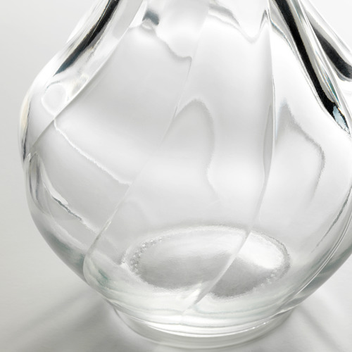 Jarrón de vidrio transparente, elegantemente texturizado, es único, refinado y delicado.