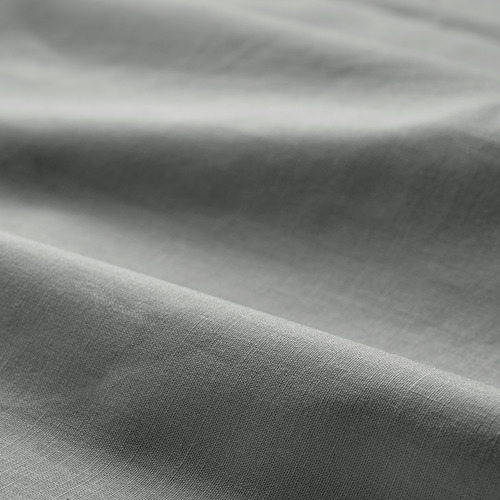 Tela de algodón gris doblada, textura lisa, tacto suave, patrón de tejido natural.