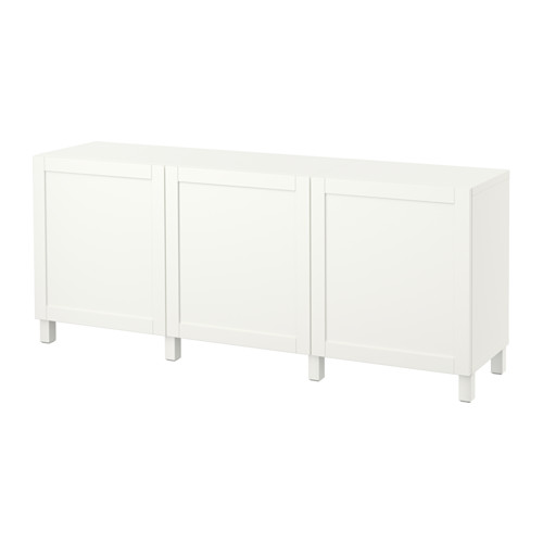 White BESTÅ sideboard, three closed cabinets on legs, minimalist design.