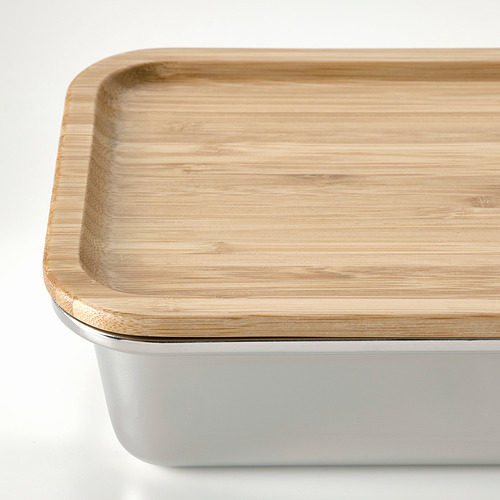 Recipiente de acero inoxidable para alimentos con tapa de bambú hermética.