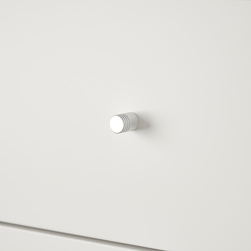 Gancho blanco moderno y minimalista montado en una pared blanca impoluta.