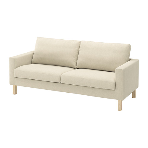 Sofá beige SALTSJÖBADEN , diseño moderno con patas de madera clara.