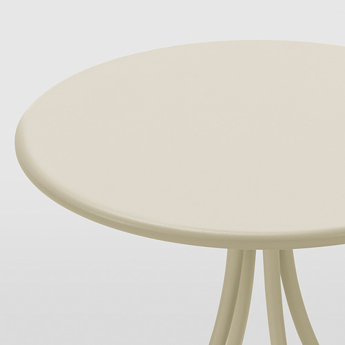 Mesa auxiliar redonda de color beige con tres patas, superficie lisa y robusta.