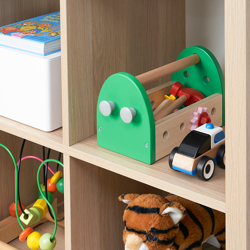 A wooden toy toolbox on a shelf, containing colorful tools and wheels, designed for childrens imaginative play and motor skill development.