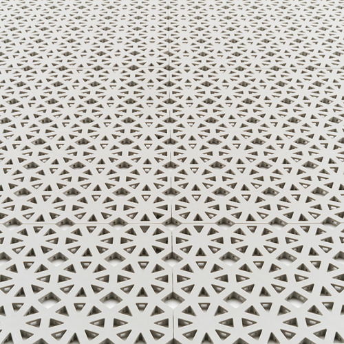 Paneles de suelo geométricos blancos, cortados y encajados con precisión, que muestran un diseño de alta calidad y durabilidad.