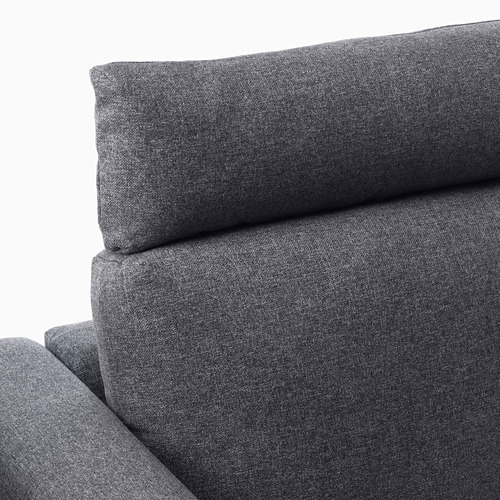 Un primer plano de un moderno sofá de tela gris con un acogedor reposacabezas acolchado, que destaca su diseño cómodo y de alta calidad.