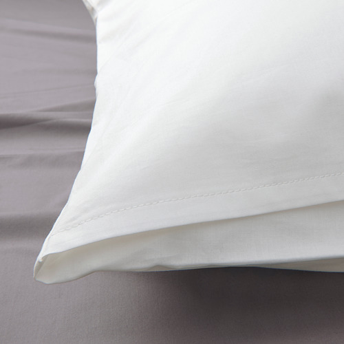 Funda de almohada blanca y nítida que muestra un alto número de hilos, exudando durabilidad y suavidad.