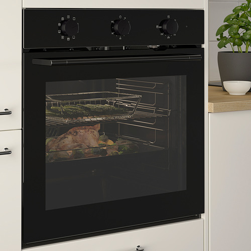 Horno empotrado negro con cocción de alimentos en su interior, con distribución uniforme del calor y función de autolimpieza, ambientado en una cocina moderna.