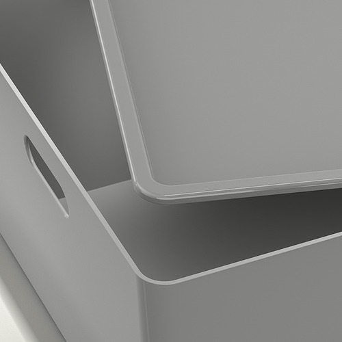 Primer plano de una elegante y moderna caja de almacenamiento; Acabado gris liso, detalle de asa.