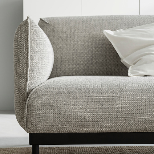 Moderno sofá de tela gris con elegantes patas negras, diseño minimalista.