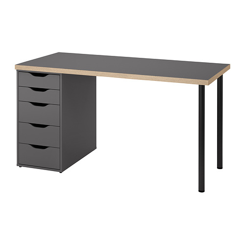 Moderno escritorio gris con cuatro cajones, elegantes patas negras y un diseño minimalista. El canto con estampado de nido de abeja añade estilo.
