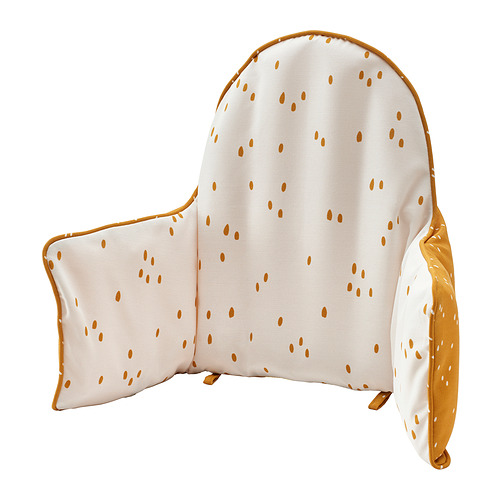 Un cojín de apoyo para bebés hinchable ANTILOP, blanco con puntos naranjas, reversible y diseñado para la estabilidad.