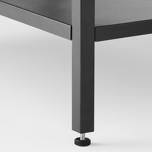 Primer plano de la pata de la mesa moderna con pie de página ajustable para mayor estabilidad.