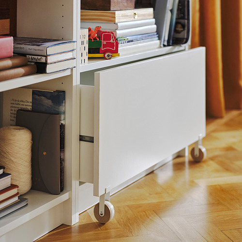 Estantería blanca BILLY con cajón con ruedas para guardar libros y juguetes.