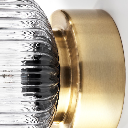 Lámpara de metal dorado y cristal texturizado transparente, diseño moderno.