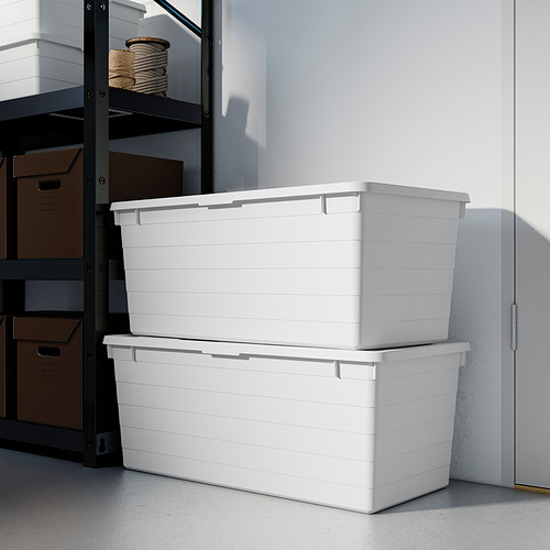 Dos grandes cajas de almacenamiento blancas, apiladas ordenadamente en una esquina. Ideal para organizar y proteger artículos más voluminosos.