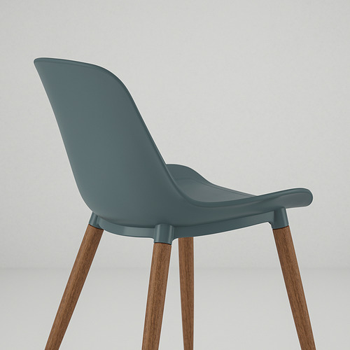 Una silla moderna con un cómodo asiento curvo de color verde azulado y robustas patas de madera.