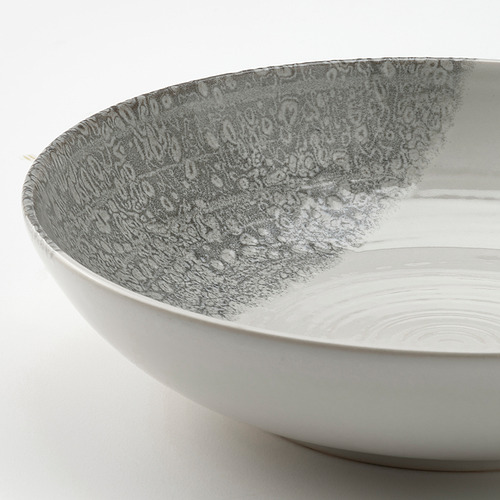 Plato KRUSTISTEL con base blanca y esmalte gris jaspeado, con una textura rústica y artesanal.
