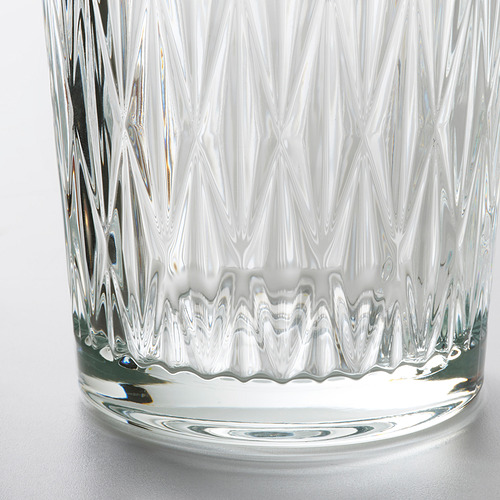 Jarrón de vidrio transparente con un diseño intrincado y estriado, que muestra artesanía de alta calidad y un estilo elegante y atemporal.