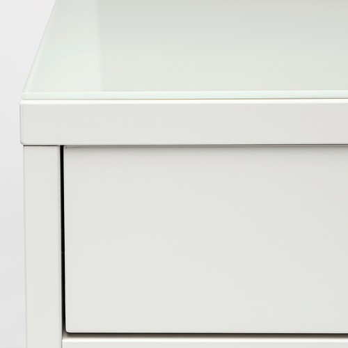 Moderno tocador blanco con tapa de cristal liso y amplio cajón, con un diseño y materiales de alta calidad.