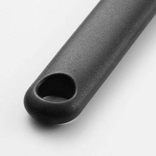 Mango de cepillo de silicona negra, texturizado para agarre, con un orificio para colgar.