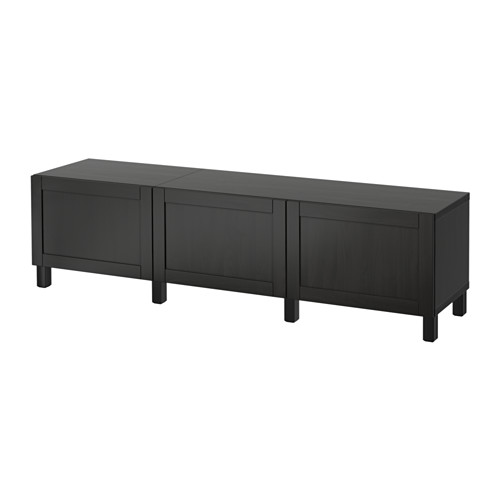 A black BESTÅ storage unit with a sleek design, featuring multiple compartments and legs for easy cleaning.