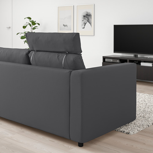 Moderno sofá VIMLE gris en salón, grande, con reposacabezas y mueble de tv.