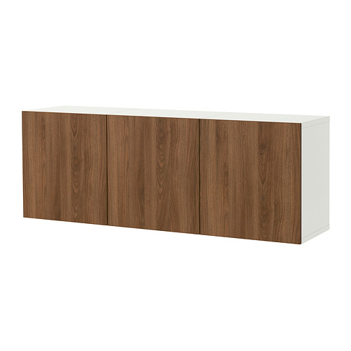 Un armario de pared BESTÅ blanco con cuatro puertas con vetas de madera marrón y sin tiradores visibles. El armario es rectangular y está diseñado para el almacenamiento.