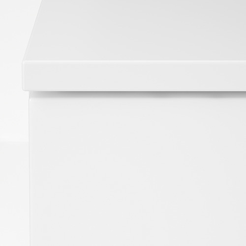 Cómoda blanca moderna con líneas suaves y limpias y construcción robusta.
