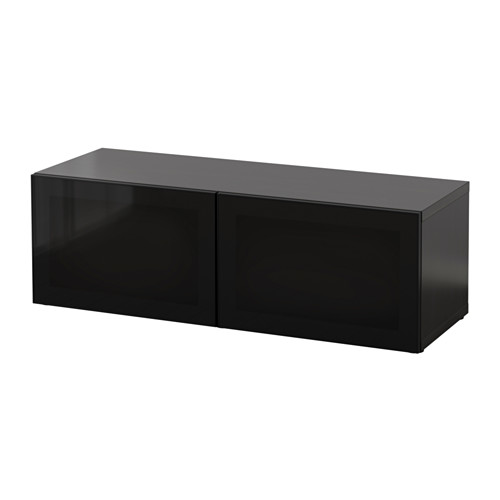 Black BESTÅ storage unit, sleek, rectangular, high-gloss design with two glass doors.