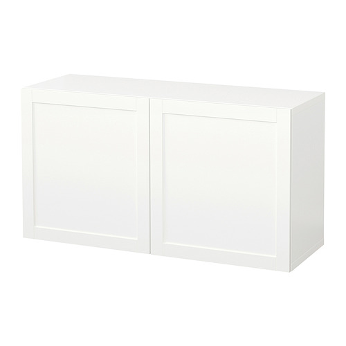 A white BESTÅ storage unit; rectangular, two-door design, made from particleboard and fibreboard.