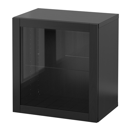 Un armario BESTÅ negro de ikea con puerta y estantes de cristal, diseñado para el almacenamiento.