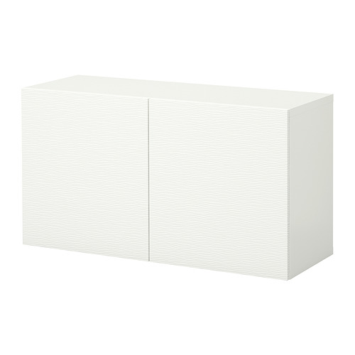 Mueble blanco BESTÅ. Diseño minimalista con forma cuadrada, textura de vetas de madera.