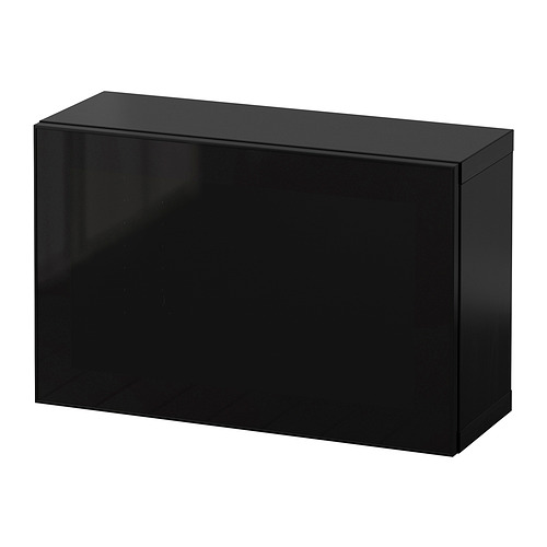 Mueble rectangular negro, elegante y moderno, con superficies lisas. Forma parte de la serie BESTÅ, adecuada para diversas necesidades de almacenamiento.