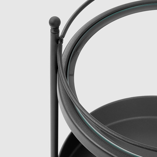 Carro de baño de metal negro con asa curva y estante de cristal.