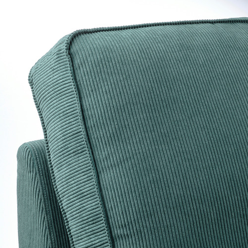 Rincón de sofá con textura verde azulado: felpa, acanalado, acogedor, tapicería de calidad.