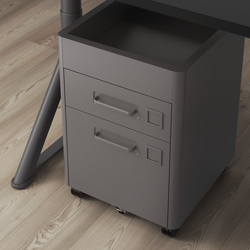 Moderna cajonera de oficina gris con ruedas para facilitar su desplazamiento. Cajones de cierre suave para un uso silencioso.