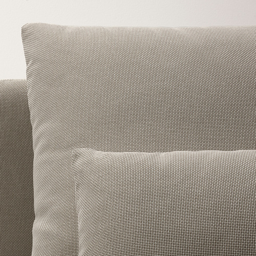Detalle de tela gris suave y texturizada del sofá moderno, que enfatiza la comodidad y la calidad.