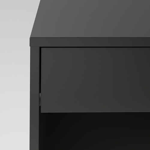 Primer plano de una elegante y moderna mesa negra con bordes lisos, que muestra un acabado y un diseño de alta calidad.