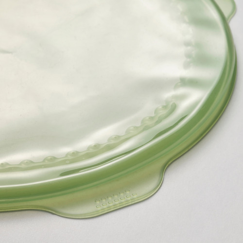 Cubierta de alimentos de caucho de silicona verde, parte superior lisa, borde texturizado, queda plana.