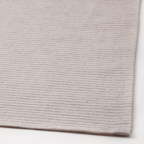 Mantel suave y tejido en tonos neutros, con textura natural de algodón y yute.