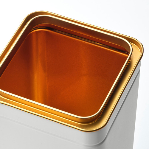 Contenedor blanco forrado en oro, acero hojalata de alta calidad, diseño elegante.