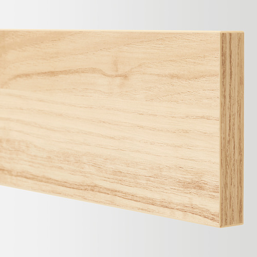 Primer plano del frente del cajón con acabado de madera de fresno claro, liso y bien trabajado, resalta la textura y la calidad de la madera natural.