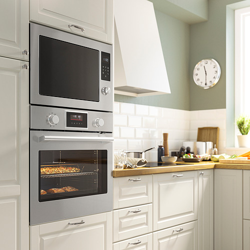 Horno empotrado de acero inoxidable IKEA STENABY con microondas arriba, diseño elegante.