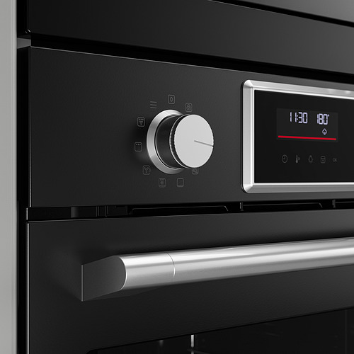 Panel de control moderno del horno con perillas elegantes y pantalla digital.