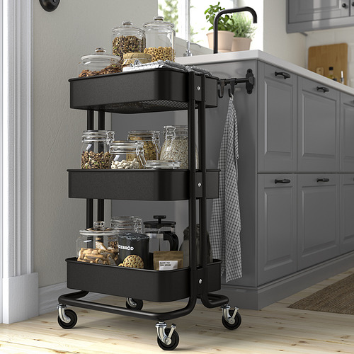 Carro RÅSKOG negro, 3 estantes, ideal para el almacenamiento en la cocina, fácil de mover.