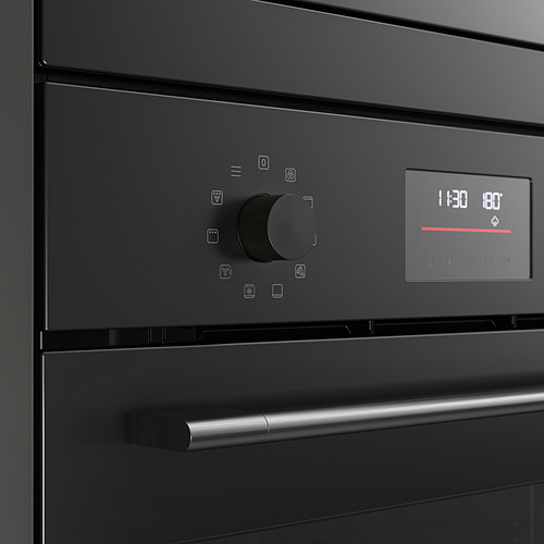 Horno negro de alta tecnología con perillas elegantes y pantalla digital. Controles modernos y fáciles de usar para una cocción precisa.